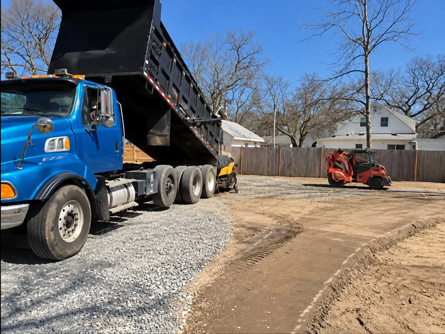 RS Superior dump truck and compact equipment preparing the base for new pavement